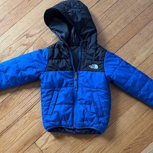 The North Face Kids' Black and Blue Puffer Jacket reversible
